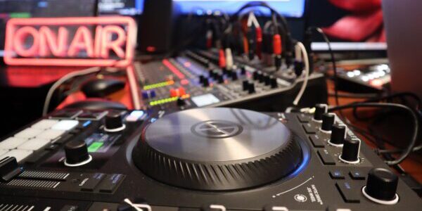 A dj 's equipment is shown in front of the camera.